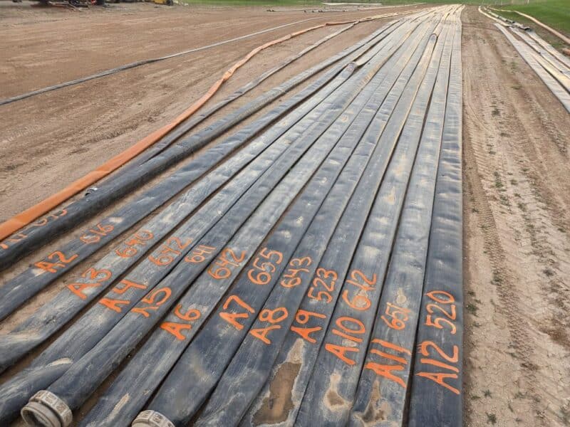$6.5/ft -> 1.5 miles (12 Sections) of Used 10″ TPU Supply hose w. U.S.Coupling Coupler sets.