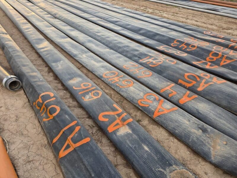 $6.5/ft -> 1.5 miles (12 Sections) of Used 10″ TPU Supply hose w. U.S.Coupling Coupler sets.