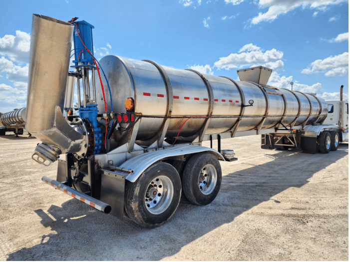 Modern stainless steel manure tanker trailer designed for efficient manure transport and field application.