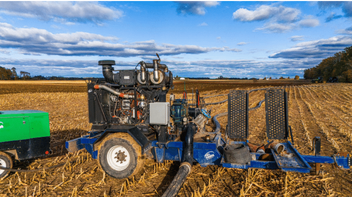 High-performance dragline manure pump system working in a field for efficient nutrient application and soil health.