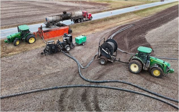 Portable air compressor used with tractor to clear manure hoses and support efficient farm pumping operations