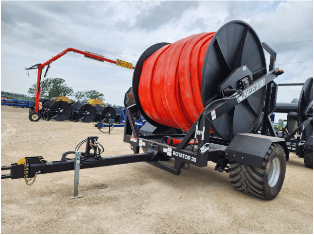 Manure drag hose reel ROTATOR 30 trailer with large hose spool used for field manure application systems.