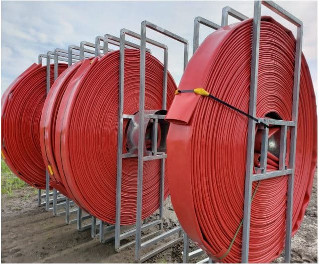 Industrial-grade manure hoses stored and maintained for reliable pumping performance throughout the manure application season
