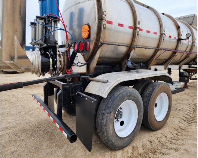 Manure tanker for sale with rear pump system, tandem wheels, and strong frame for safe and efficient manure transport