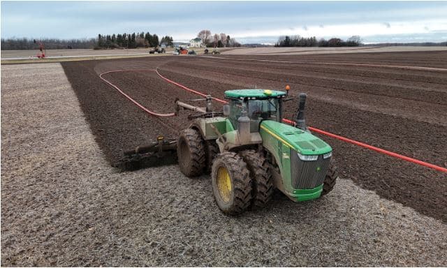 Drag hose slurry application system showing efficient manure flow and reduced fuel consumption in agricultural field